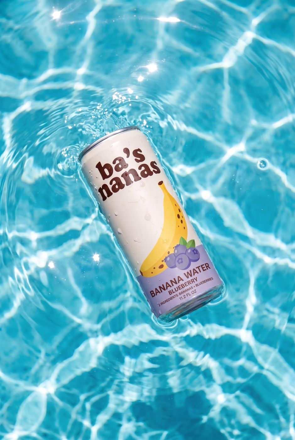 A Blueberry can floating in a pool