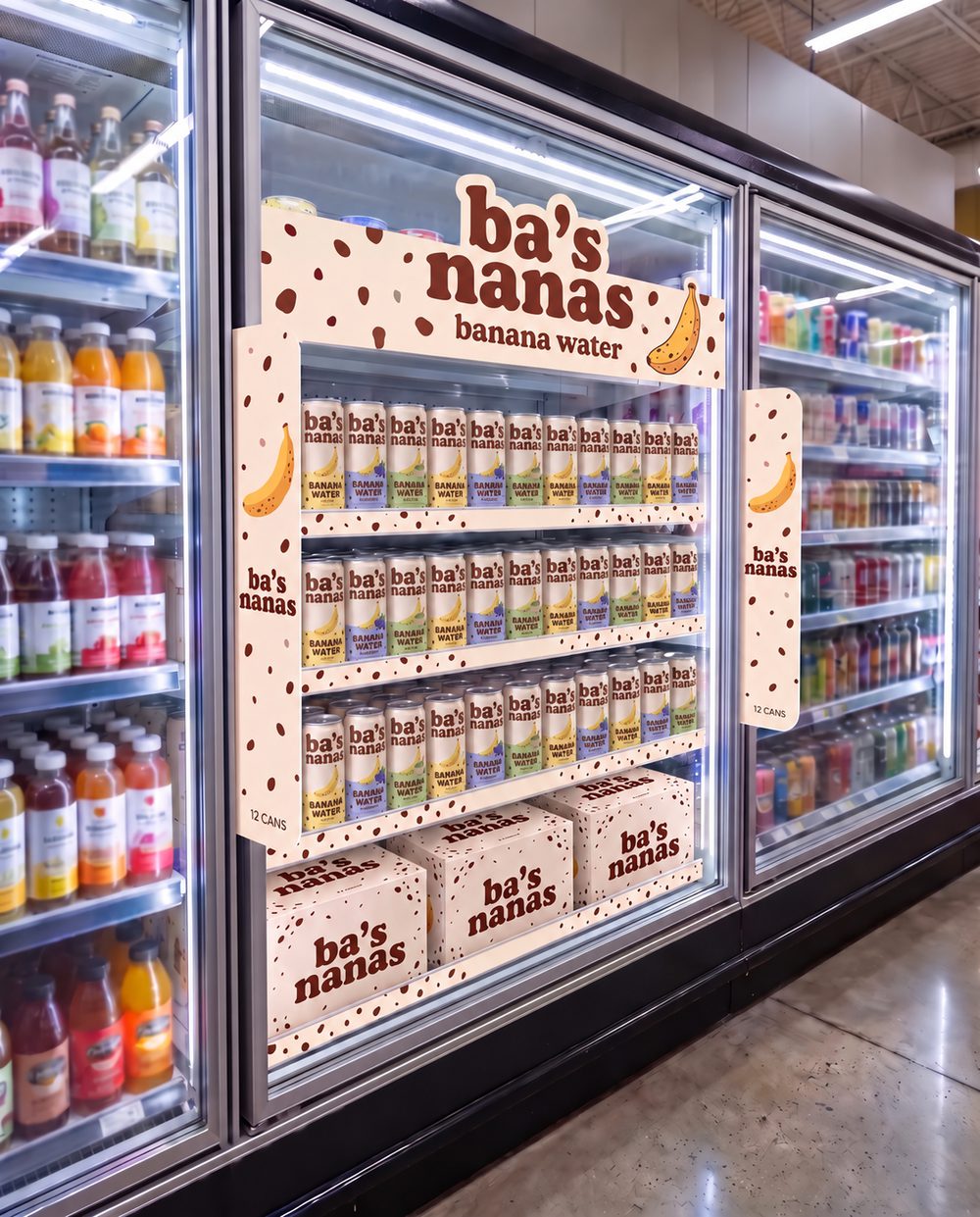 A freckled Ba's Nanas cooler-door set full of cans in a grocery store